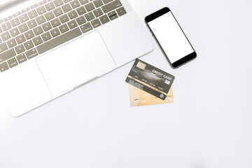 Fototapeta premium close up credit card laptop and amartphone on white background for online shopping