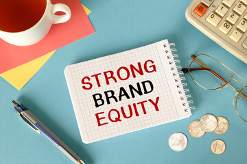 Business concept - notebook writing STRONG BRAND EQUITY