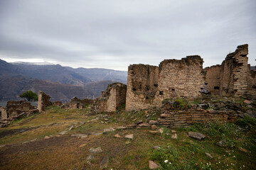 Fototapeta na wymiar Aul-ghost Goor, an abandoned village in Dagestan. Ancient defensive towers.