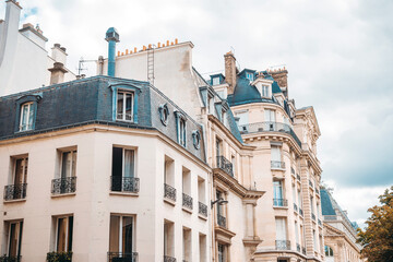 Antique building view in Paris city, France.