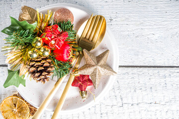 Christmas or New Year table setting. Place setting for Christmas Dinner with Xmas Holiday Decorations