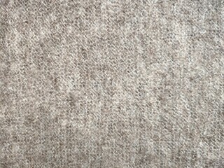 texture of grey knitted fabric made of natural wool