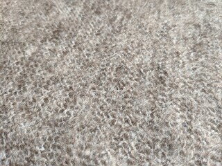 texture of grey knitted fabric made of natural wool