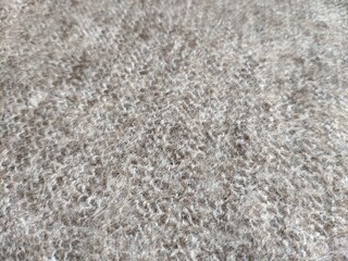 texture of grey knitted fabric made of natural wool
