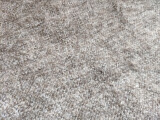 texture of grey knitted fabric made of natural wool