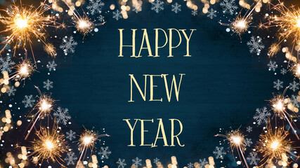 Happy New year background - Top view / above view frame mades of parklers, bokeh lights and ice crystals isolated on dark blue wooden table, wood texture
