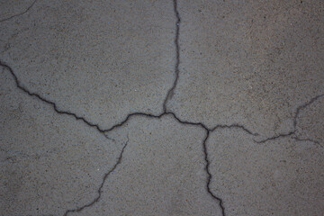 The texture of a light cracked plaster wall. background