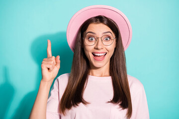 Photo of excited astonished girl get incredible idea raise index finger up isolated over teal color...