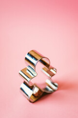 Cookie cutter on pink background