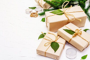 Zero waste gift concept with craft boxes and evergreen branches