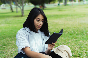 Fototapeta premium College student by the park.