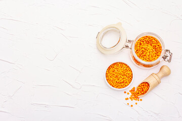 Dry orange lentils in glass jar