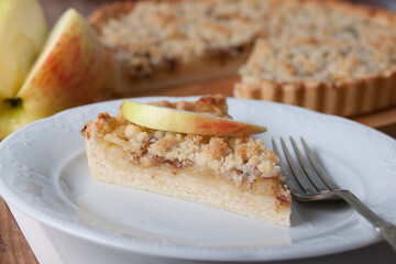 Piece of pie with apples and streusel