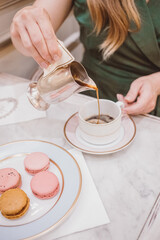 woman making a cup of coffee