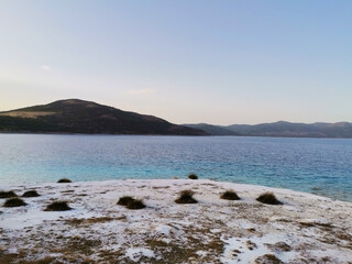 Salda Lake. Colorful lake. View of the lake, mountains, sky.