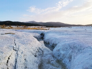 Around Salda Lake. The land and mountains around the lake. Water flowing into the lake.