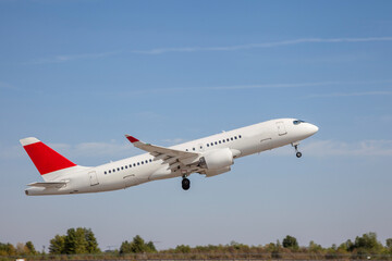 White plane flies in the sky. Takeoff and landing. Arrival and departure. Place for your text....