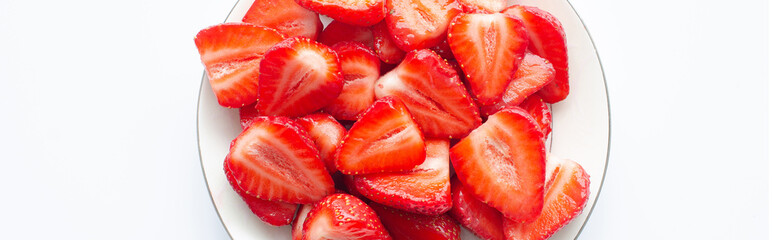 red raw fresh strawberries on plate, close view 