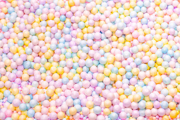 Purple, yellow, blue plastic balls.