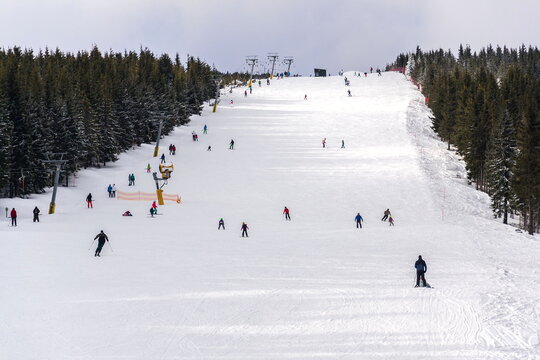 Piste with unrecognizable people skiing, snow, sunny winter day, Horni Mala Upa, Krkonose mountains, Czech Republic