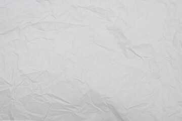 Crumpled white paper background.