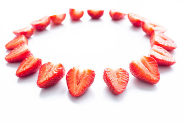 red raw fresh strawberries on white background, close view 