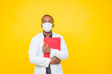 African male doctor wears a protective mask and holding a medical report