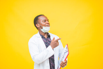 African male doctor wears a protective mask