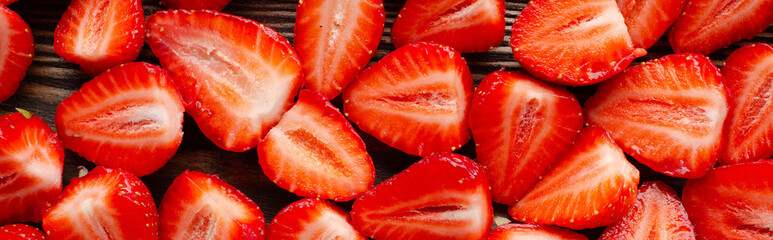 red raw fresh strawberries on wooden background, close view 