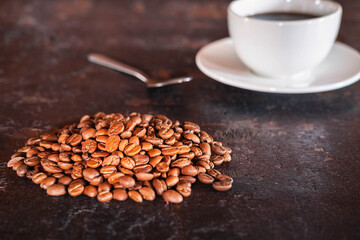 Coffee cups and coffee beans on a wooden background