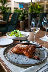 roasted chicken on gray plate