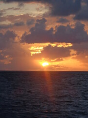 Naklejka na ściany i meble The stunning sunsets, beaches, coral reefs and huts on the Belize Islands in the Caribbean Sea
