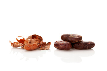 Fresh roasted cocoa beans and peels isolated on white background.
