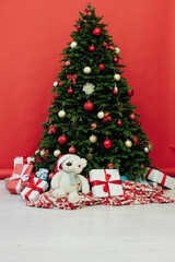 Christmas tree pine with gifts for the new year red decor winter