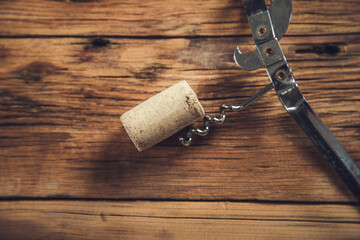wine cork and corkscrew on the table