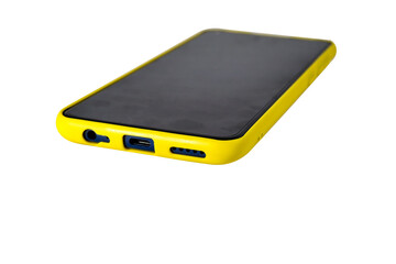 Smartphone in a yellow case isolate on a white background.