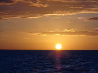The stunning sunsets, beaches, coral reefs and huts on the Belize Islands in the Caribbean Sea