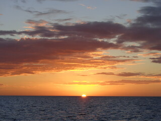 The stunning sunsets, beaches, coral reefs and huts on the Belize Islands in the Caribbean Sea