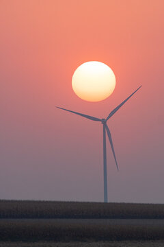 Orange Sunrise over a Windmill