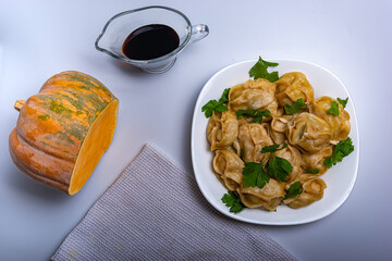 Manta rays with pumpkin soy sauce on a white background