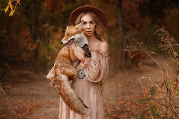girl in a fabulous image with a fox in the woods. image for Halloween
