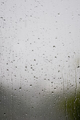 Rain on window pain on a wet and gloomy day. High quality photo