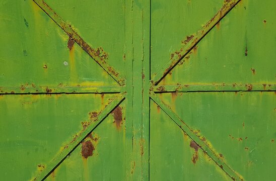A metallic green gate for background backdrops or copy space