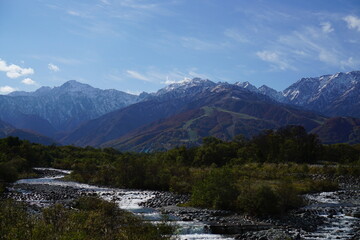 Autumn colorful foliage. mountains have 3 different colors made by nature, white, red, green. 