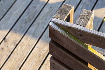 A close-up of the railing on a wooden terrace railing
