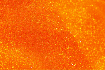 Orange glitter bokeh circle glow blurred and blur abstract. Glittering shimmer bright luxury . White and silver glisten twinkle for texture wallpaper and background backdrop.
