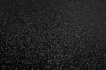 Black glitter bokeh circle glow blurred and blur abstract. Glittering shimmer bright luxury . White and silver glisten twinkle for texture wallpaper and background backdrop.

