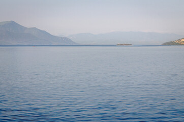 Evia island, Greece - June 28. 2020: Panorama of the Greek island of Evia from the ferry 