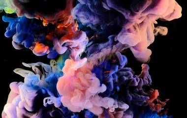 Fototapeta premium Color drops in water , abstract color mix , drop of Ink color mix paint falling on background,