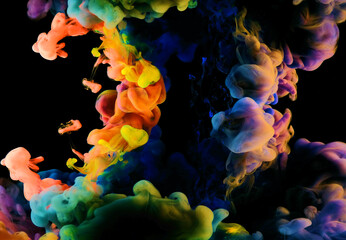 Color drops in water , abstract color mix , drop of Ink color mix paint falling on background,